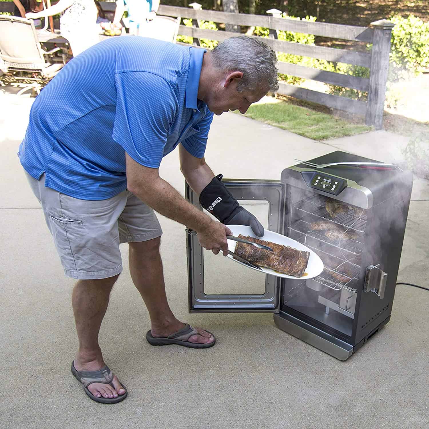 man grilling in a char-broil smoker man grilling in a char-broil smoker